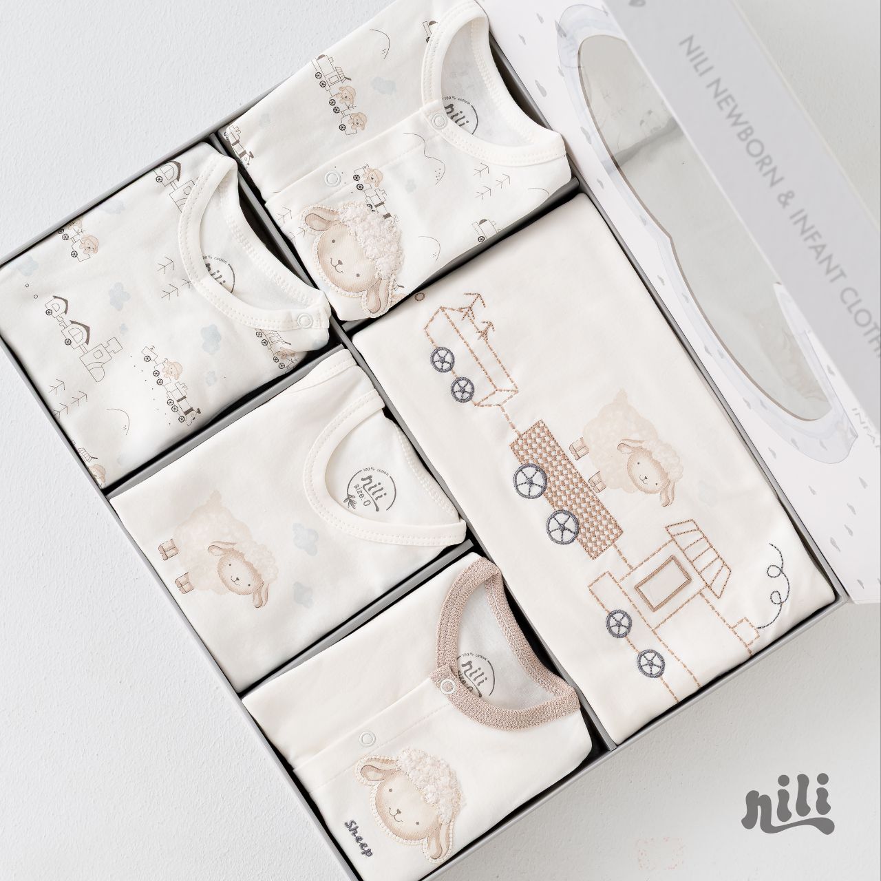 ست لباس سیزده ۱۳ تیکه نوزادی نیلی nili طرح قطار